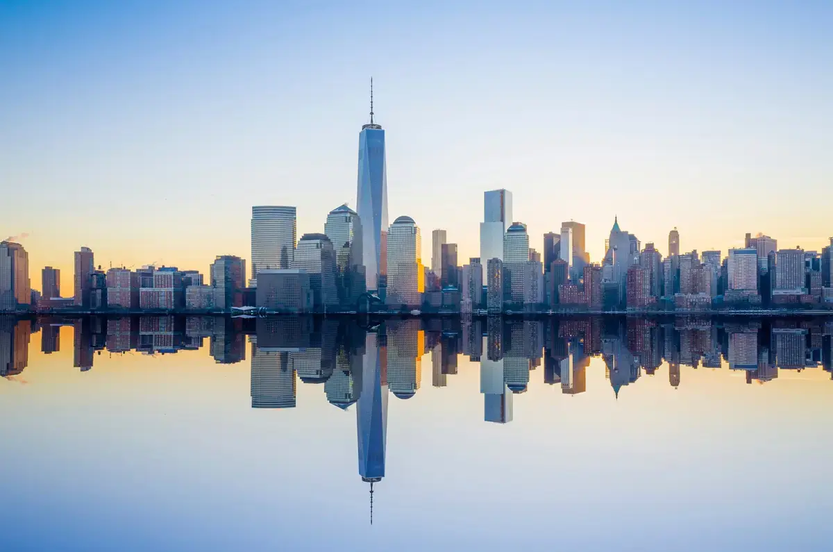 Lower Manhattan skyline reflected in the water at blue hour